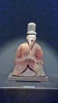 Seated male Shinto deity.