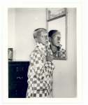 Claude Cahun - Self Portrait (Reflected image in mirror, checked jacket) 1928. Courtesy of Jersey Heritage Collections.